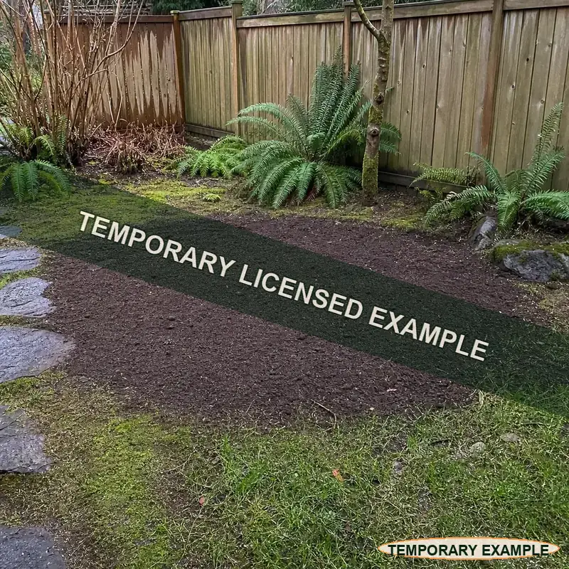 Temporary licensed example of a finished yard area after stump grinding and cleanup